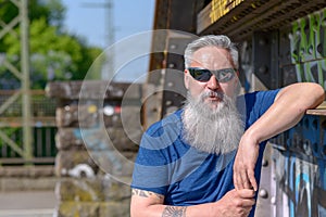 Trendy attractive bearded man in sunglasses