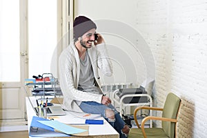 Trendy businessman hipster informal look smiling happy on mobile phone