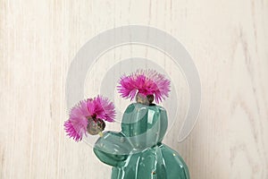 Trendy cactus shaped ceramic vase with flowers