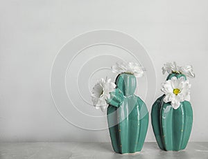 Trendy cactus shaped vases with flowers