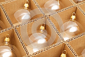 Trendy Christmas background. Transparent glass Christmas balls in box ready for holiday compositions. Christmas market