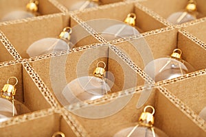 Trendy Christmas background. Transparent glass Christmas balls in box ready for holiday compositions. Christmas market