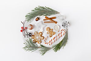 Trendy creative Christmas  winter  new year composition. Pine tree branches  Christmas decorations on white background.