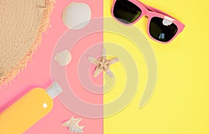 Trendy fashion beach accessories on a bright colorful background. Dried starfish, shells, a bottle of sunscreen lotion, a fragment