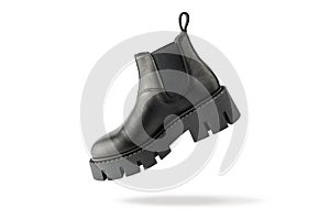 Trendy fashionable black leather short womens chelsea boot flying isolated on white background