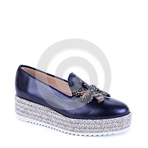 Trendy female shoes (black loafer) on a white background.