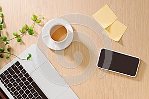 Trendy feminine home office workspace. White office desk. Laptop, coffee cup and phone, notebook, pencil. Flat lay, top view, copy
