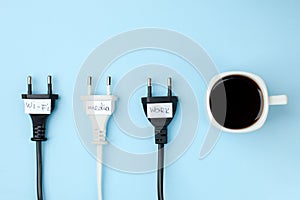 Trendy flat lay minimal concept, unplugged cord with word work, media, wi-fi and cup of coffee n bright background, concept of a b