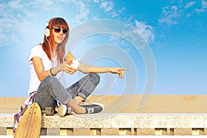 Trendy girl listens to music with smartphone