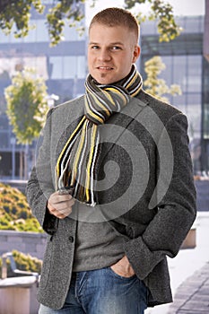 Trendy guy waiting outside of building