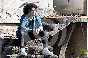 Trendy Handsome Man Posing at Ruins Ruined House