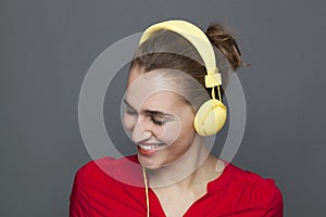 Trendy headphones concept for beautiful 20s girl smiling