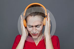 Trendy headphones concept for focused 20s girl