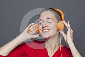 Trendy headphones concept for joyful 20s girl