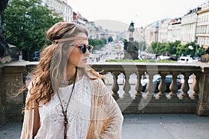 Trendy hippie woman tourist standing on Wenceslas Square, Prague