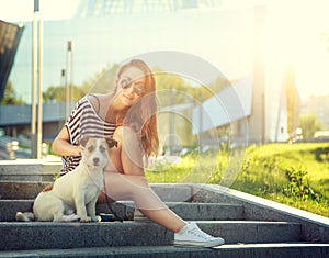 Trendy Hipster Girl with her Dog in the City