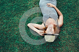 Trendy Hipster Girl Relaxing on the Grass