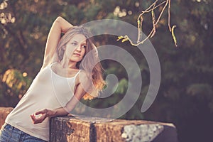 Trendy Hipster Girl Relaxing on the road at the day time.