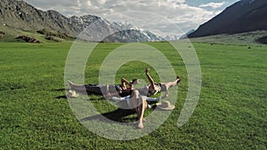 Trendy Hipster Girls Relaxing on the Grass . Summer lifestyle portrait of three hipster women laying on the grass enjoy