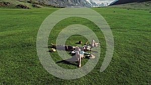 Trendy Hipster Girls Relaxing on the Grass . Summer lifestyle portrait of three hipster women laying on the grass enjoy