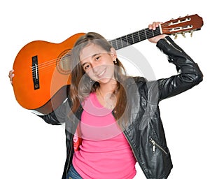 Trendy hispanic teenage girl carrying a guitar