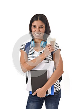 Trendy latin student girl holding notepad folder and book carrying backpack smiling happy