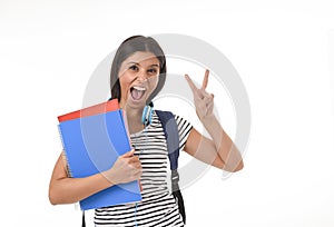 Trendy latin student girl holding notepad folder and book carrying backpack smiling happy