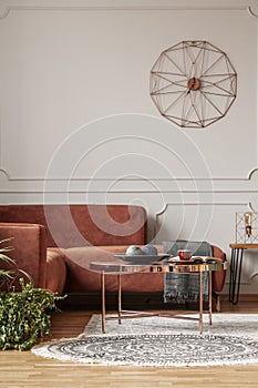 Trendy living room interior with brown corner sofa