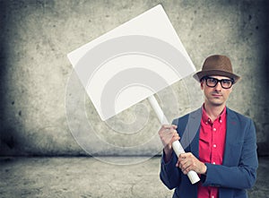 Trendy man holding protest sign