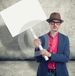 Trendy man holding protest sign