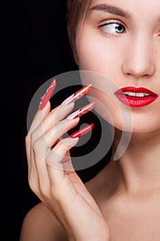 Trendy manicure and red lips. Beauty fashion makeup and manicure.