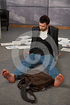 Trendy office worker on floor