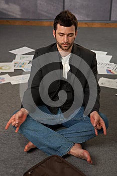 Trendy office worker meditating