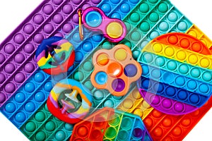 Trendy Pop it Fidget toys. Different colorful rubber toys for children. Simple dimple, snapperz, spinner and others