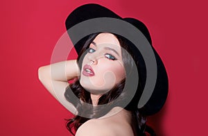 Trendy retro fashion. High-fashion portrait. Sexy sensual elegant woman in black hat. .