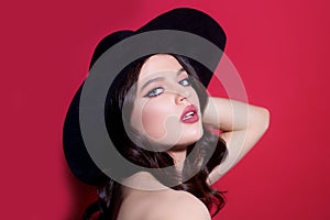 Trendy retro fashion. High-fashion portrait. Sexy sensual elegant woman in black hat. Isolated.