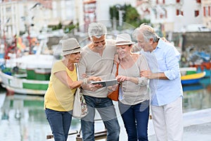 Trendy senior couples together on a trip photo