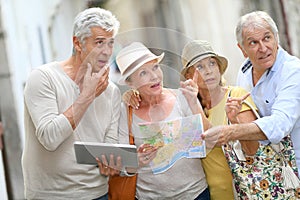 Trendy senior people travelling and visiting monuments