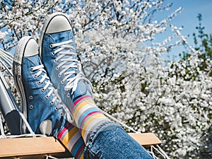 Trendy sneakers and bright socks. Men`s and women`s style