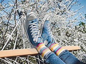 Trendy sneakers and bright socks. Men`s and women`s style