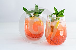 Trendy summer basil seeds iced drinks with citrus and mint