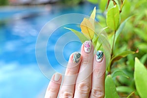Trendy summer manicure flamingoes palm leaves swimming pool