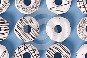 Trendy sunlight Summer pattern made with glazed donut with sprinkles on a blue