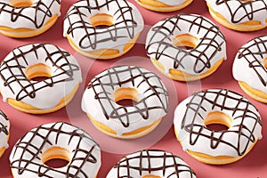 Trendy sunlight Summer pattern made with glazed donut with sprinkles on a pink