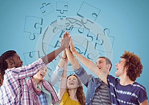 Trendy team putting hands together against blue jigsaw doodle and blue background