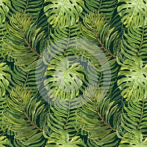 Trendy tropical seamless background pattern. Watercolor green tropic forest palm tree leaves on green backdrop. Summer jungle