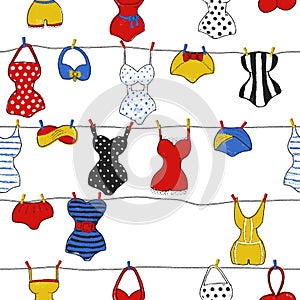 Trendy vector seamless pattern with cute swimsuits