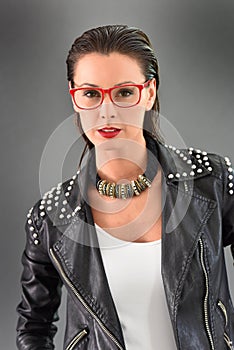 Trendy woman in rock style posing