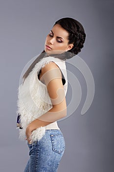 Trendy Woman in Sleeveless Jacket and Jeans