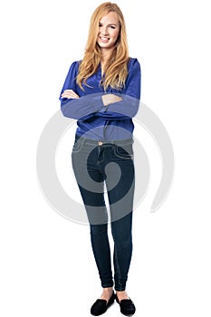 Trendy woman standing with folded arms